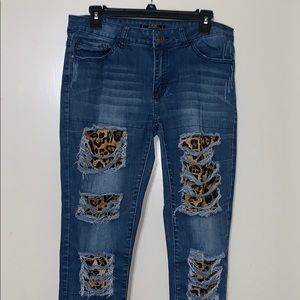 Distressed leopard jeans